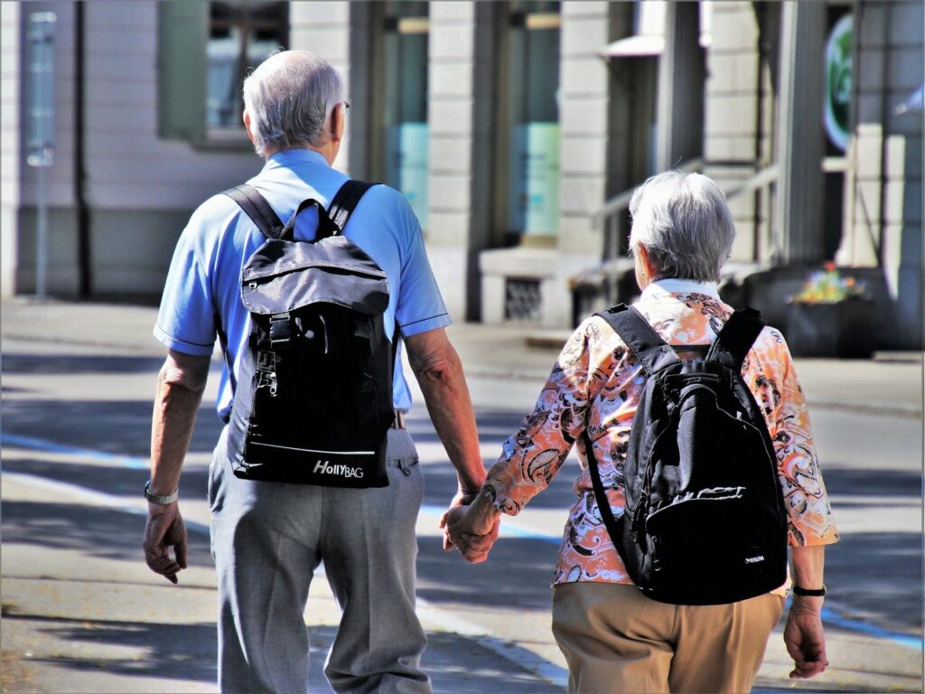 retired grandparents holding hands
